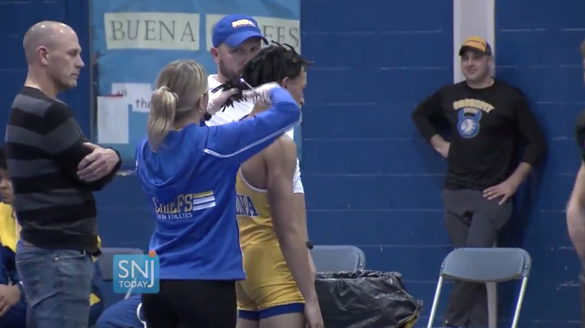 Andrew Johnson, a black wrestler from Buena Regional High School in New Jersey, was told that he had to cut his dreadlocks or forfeit his match, media says. Video shows Johnson’s hair being cut.