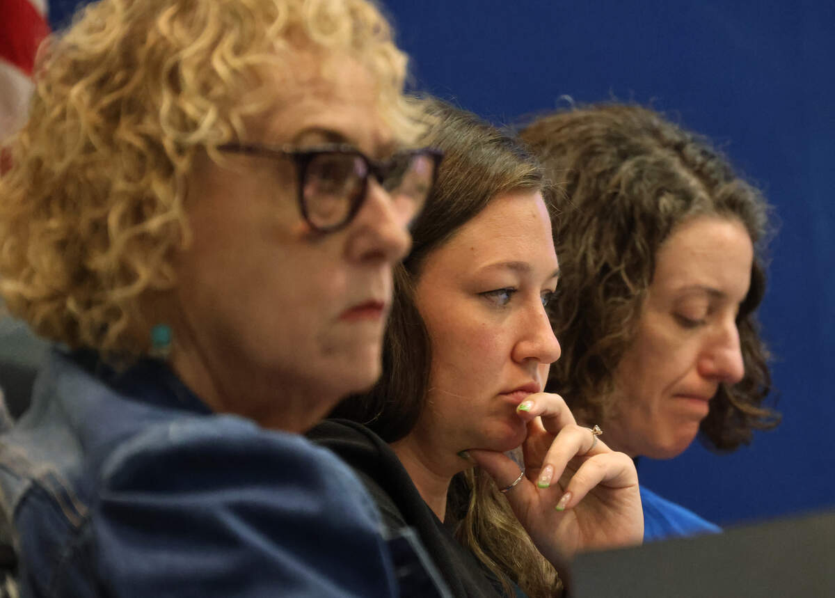 Broward County School Board members Nora Rupert, left, Rebecca Thompson, and Maura McCarthy Bulman, right, listen to public comment during a meeting regarding potential job cuts on May 11.