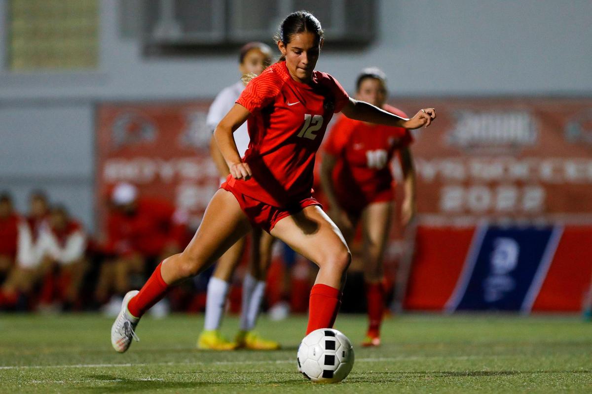 Doral Academy Olivia Vargas (12) scores a goal from the penalty spot against Coral Reef during the second half of a Region 4-7A quarterfinal playoff game at Doral Academy High School in Doral, Florida on Tuesday, February 7, 2023.