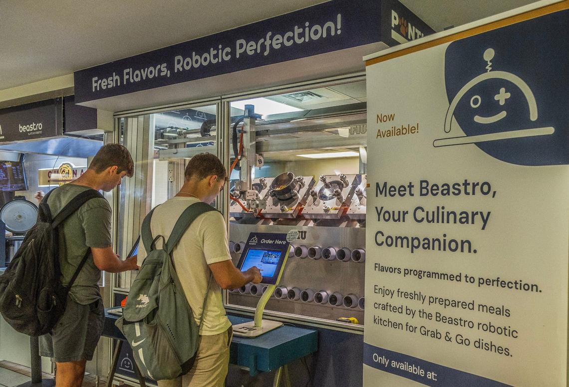 FIU students order at Beastro, the robotic kitchen at the 8th Street Campus Kitchen at the university’s Graham Center. The robotic kitchen specializes in stir fries and pasta dishes.