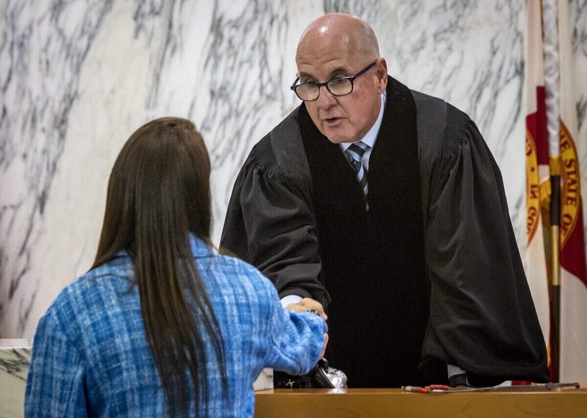 Ronit Felszer, left, approached Judge Michael Hanzman and shook his hand after proceedings on May 11, 2022, that settled class-action litigation over the collapse of Champlain Towers South, with plaintiffs expected to receive just under $1 billion.