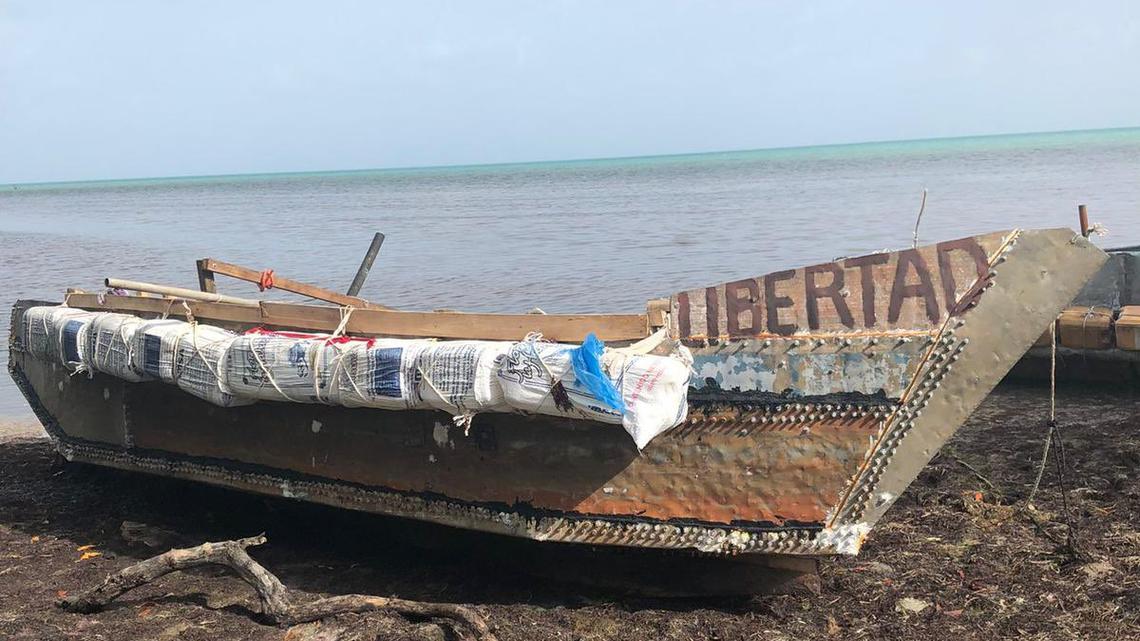 A homemade, wooden boat with the word ‘Libertad’ sits on the shore of the Middle Florida Keys city of Marathon Wednesday, Aug. 10, 2022. The Border Patrol says the vessel is a Cuban migrant vessel.