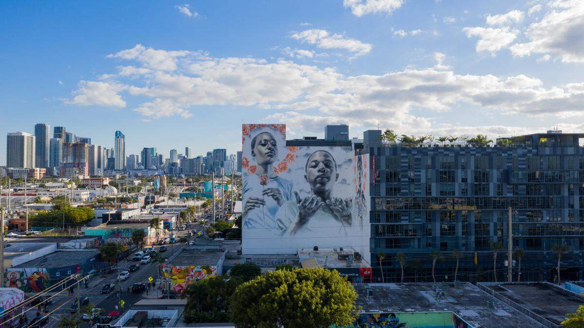 A mural by artist El Mac graces a wall on an apartment building in Wynwood. One of the neighborhood’s most popular restaurants, Kyu, has been bought for a planned global expansion.