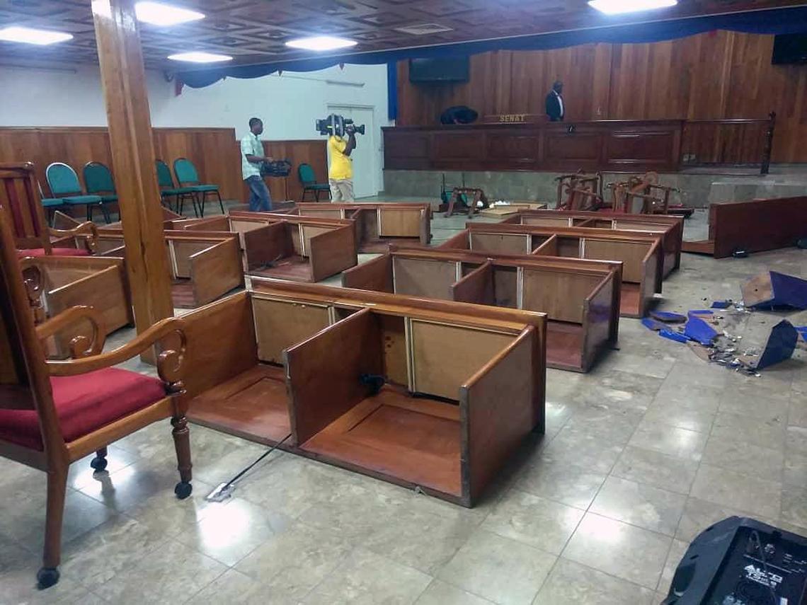 Scene inside the Haitian Senate on Thursday, after opposition senators began overturning and throwing out furniture.