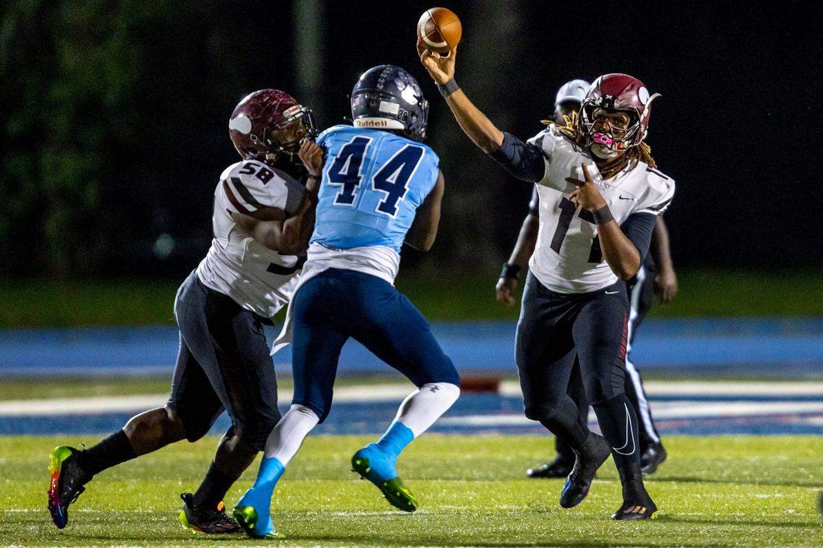 Miami Norland quarterback Ennio Yapoor (17) throws the ball during a high school football game against Miami Palmetto at Tropical Park in Miami, Florida, on Thursday, October 20, 2022.