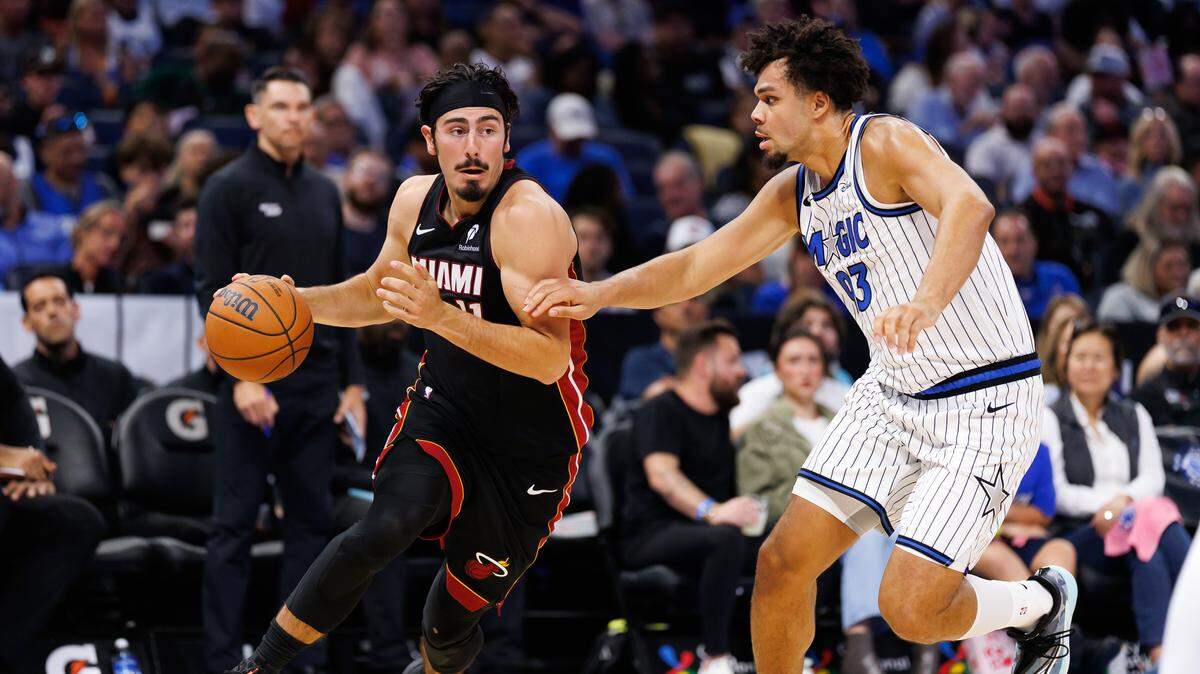 Miami Heat guard Jaime Jaquez Jr. (11) drives to the basket at Orlando Magic forward Noah Penda (93) during the first half at Kia Center.
