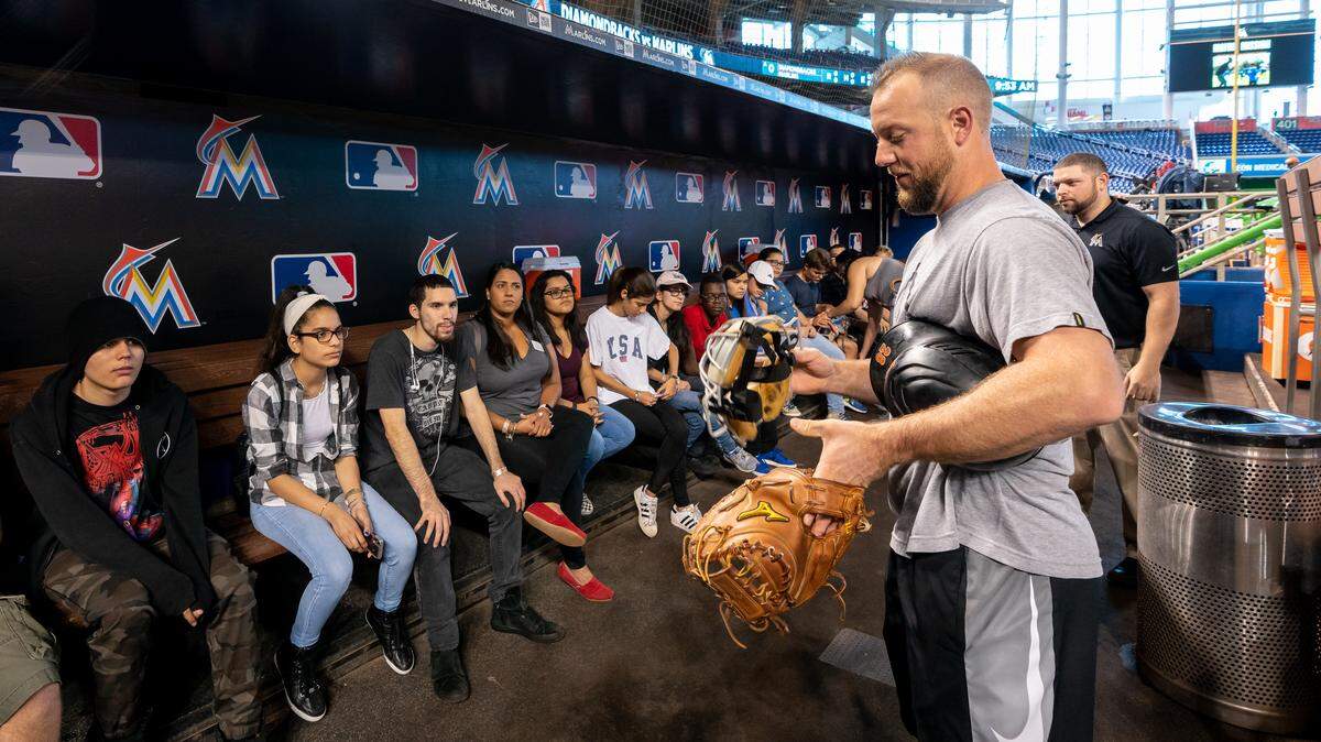 Miami Lighthouse for the Blind students talk to Marlins catcher Bryan Holaday during a June 28 tour of Marlins Park.