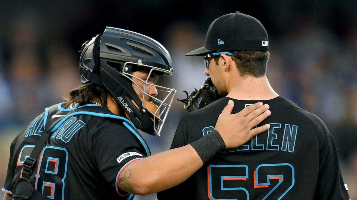 Miami Marlins catcher Jorge Alfaro speaks to pitcher Zac Gallen during the second inning against the Los Angeles Dodgers at Dodger Stadium on Friday, July 19, 2019.