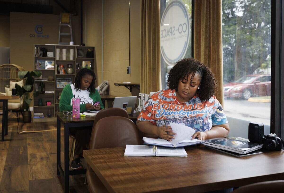 Latoya Byrd, business expansion specialist with Miami-Dade Economic Advocacy Trust, works inside Co-Space on Wednesday, June 3, 2026, in Miami Gardens, Fla. Joy St. Clair founded the space as a place for Black entrepreneurs in South Florida. “Joy is one of our grantees, she was the highest ranking applicant when she won, said Byrd. The economic development division that Byrd works for also holds their office hours at Co-Space.