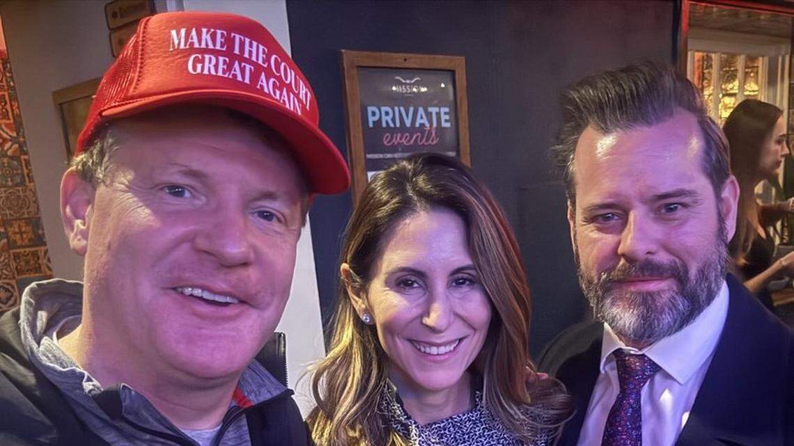 Washington, D.C., lawyer Mike Davis, a MAGA influencer, left, poses with Yara Kuklas, first assistant to the U.S. Attorney in Miami, center, and U.S. Attorney Jason Reding Quinones, right.
