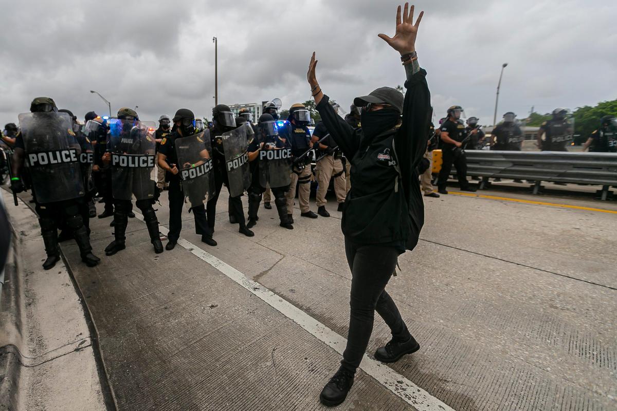 Protesters and Florida Highway Patrol officers meet on one of the ramps of the Julia Tuttle Causeway on Friday, June 5, 2020, during a Justice for George Floyd rally that began in Wynwood.