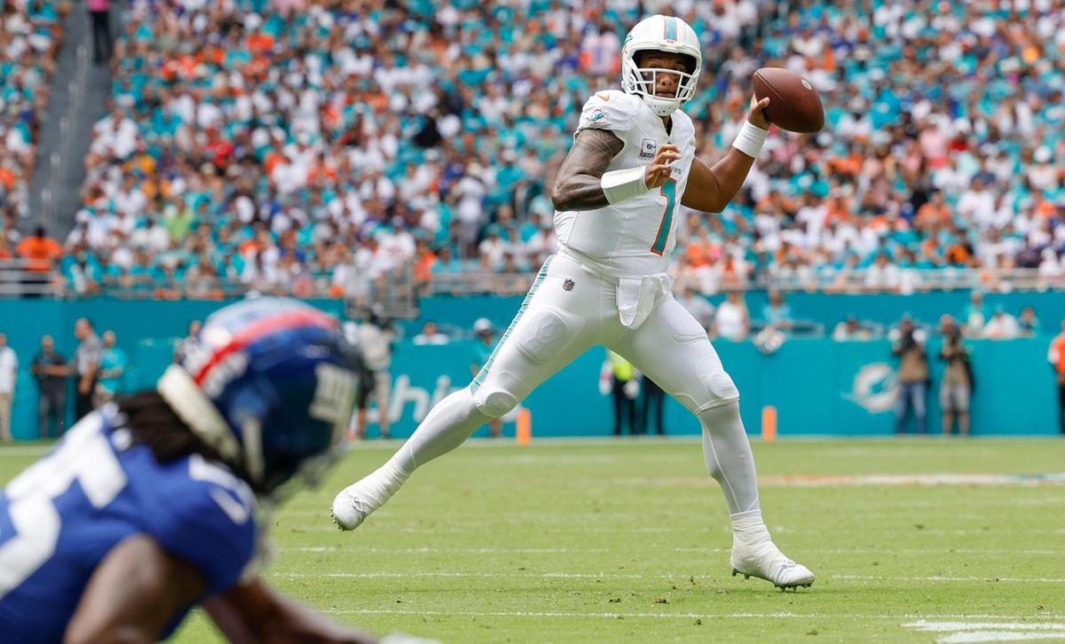 Miami Dolphins quarterback Tua Tagovailoa (1) throws a touchdown pass to wide receiver Jaylen Waddle (17) during the game against the New York Giants in the first quarter at Hard Rock Stadium in Miami Gardens on Sunday, October 8, 2023.