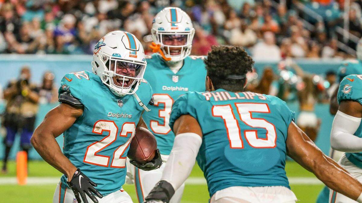 Miami Dolphins safety Elijah Campbell (22) reacts after scoring on an interception in the second quarter against the Philadelphia Eagles at Hard Rock Stadium in Miami Gardens on Saturday, August 27, 2022.