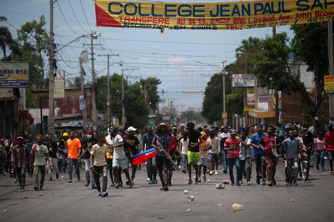 Demonstrators protest against fuel price hikes and to demand that Haitian Prime Minister Ariel Henry step down, in Port-au-Prince, Haiti, Monday, Sept. 19, 2022.