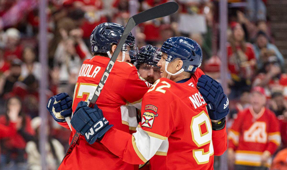 Florida Panthers left wing Jonah Gadjovich (12) celebrates with defenseman Niko Mikkola (77) and left wing Tomas Nosek (92) after scoring against the Chicago Blackhawks in the first period of their NHL game at Amerant Bank Arena on Saturday, Feb. 1, 2025, in Sunrise, Fla.