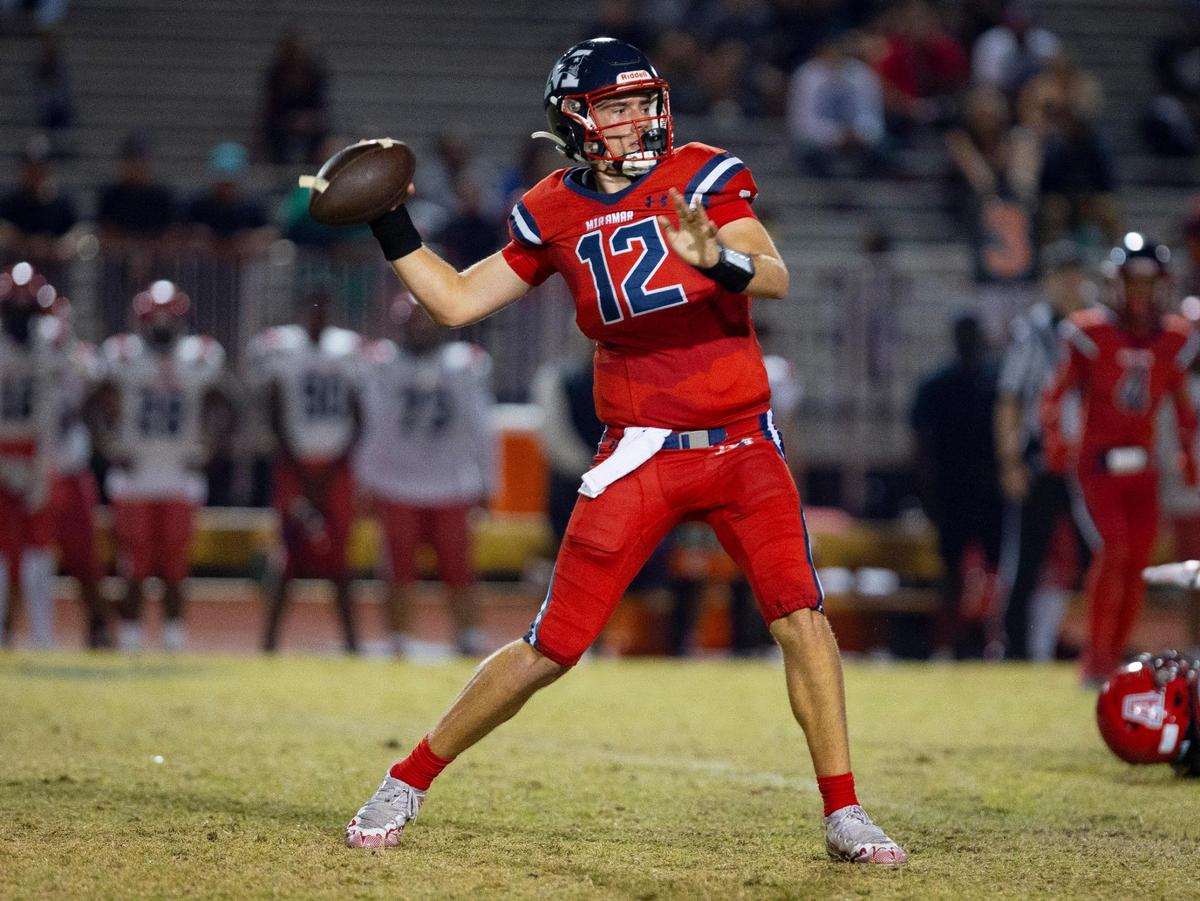 Miramar’s quarterback Kael Alexander (12) throws the football during the first quarter of a playoff game between American and Miramar on Thursday, Nov. 9, 2023, at Miramar High School.