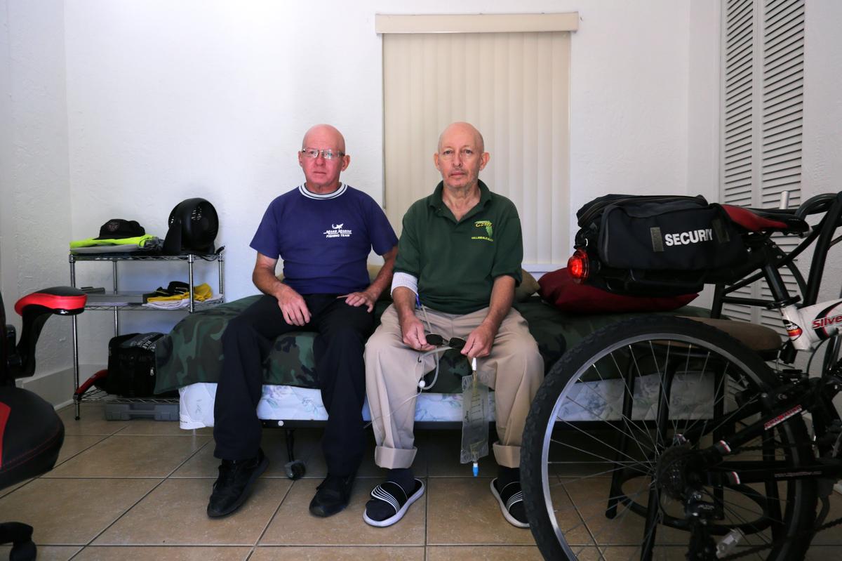 As his health has deteriorated, Marcelino Brown, right, has become more dependent on his brother Jorge Almaluez. Brown, who is epileptic, lost his job, and they had to move into a tiny studio in a Little River duplex.