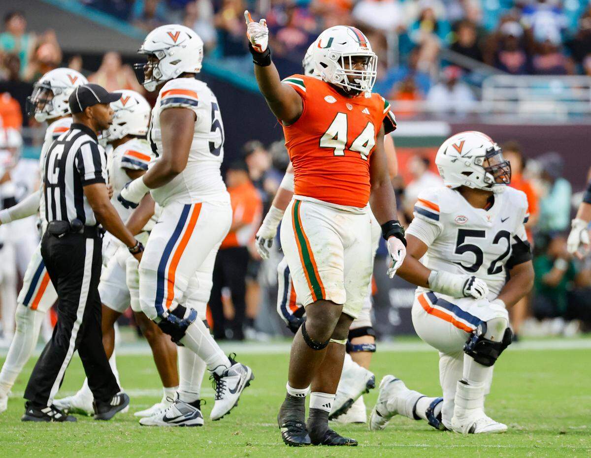 Miami Hurricanes defensive lineman Rueben Bain Jr. (44 reacts after sacking Virginia Cavaliers quarterback Tony Muskett (11) in the second half at Hard Rock Stadium in Miami Gardens on Saturday, October 28, 2023.