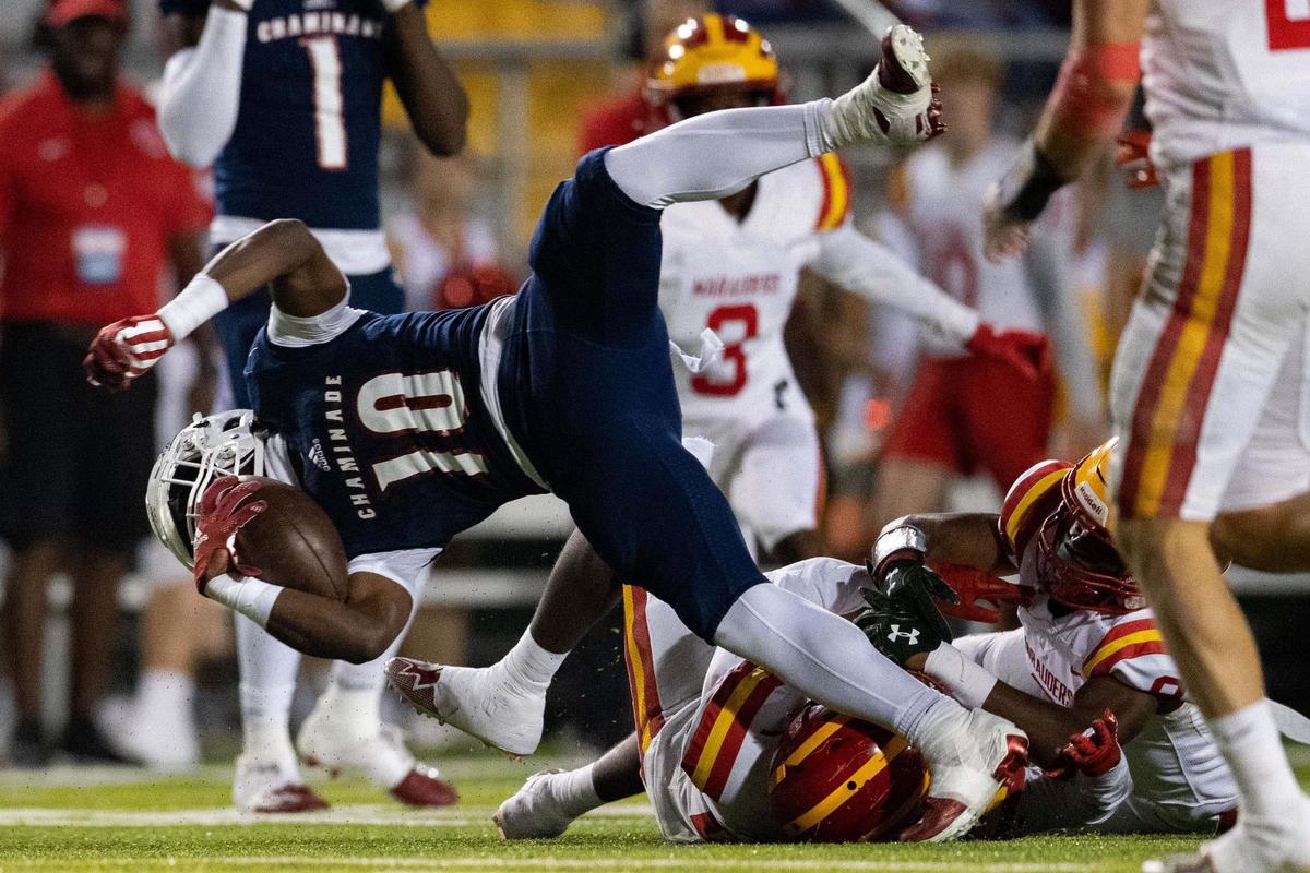 Chaminade wide receiver Duane Thomas Jr. (10) gets tripped up by a defender. The Chaminade Lions lead the Clearwater Central Catholic Marauders 28-0 at the half of the Class 1M State Championship game at Gene Cox Stadium in Tallahassee, Florida on Thursday, Dec. 8, 2022.