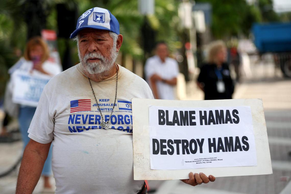 Bob Kunst, 81, of Miami Beach holds a sign as he shows his support for Israel at the Holocaust Memorial on Tuesday, Oct. 10, 2023, in Miami Beach, Fla.