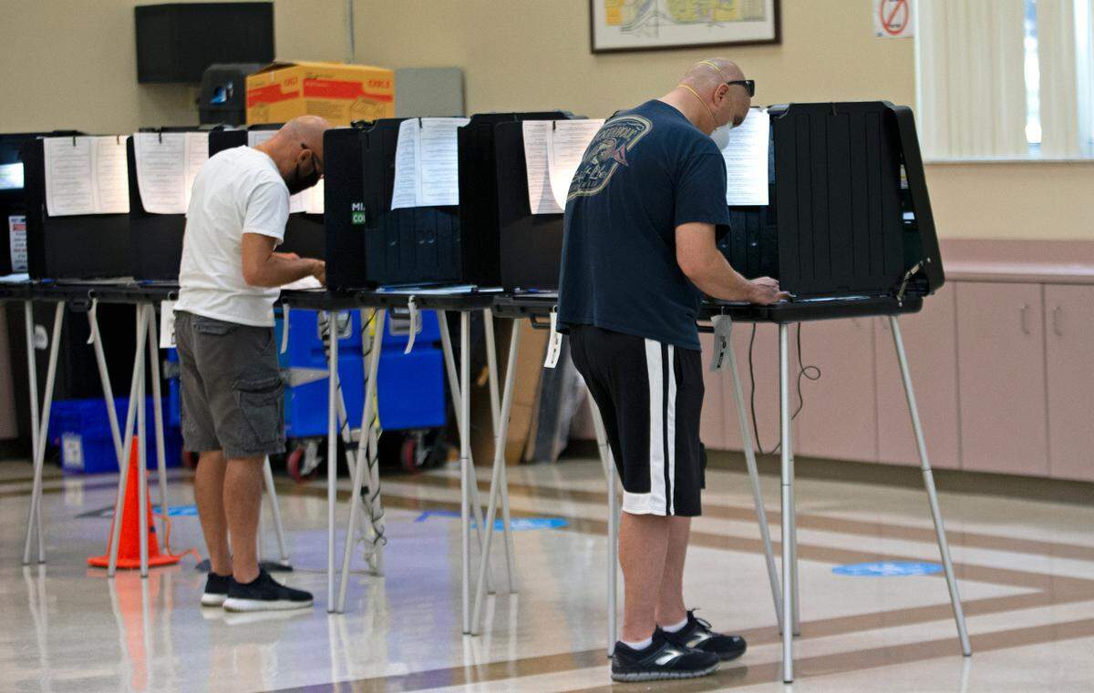 People vote during primary election early voting at Miami Lakes Community Center at 15151 Montrose Road in Hialeah on Thursday, August 13, 2020.