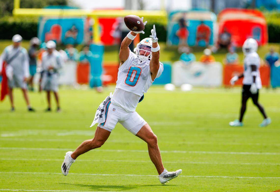 Miami Dolphins wide receiver Braxton Berrios (0) catches a pass during NFL football training camp at Baptist Health Training Complex in Hard Rock Stadium on Thursday, August 3, 2023 in Miami Gardens, Florida.