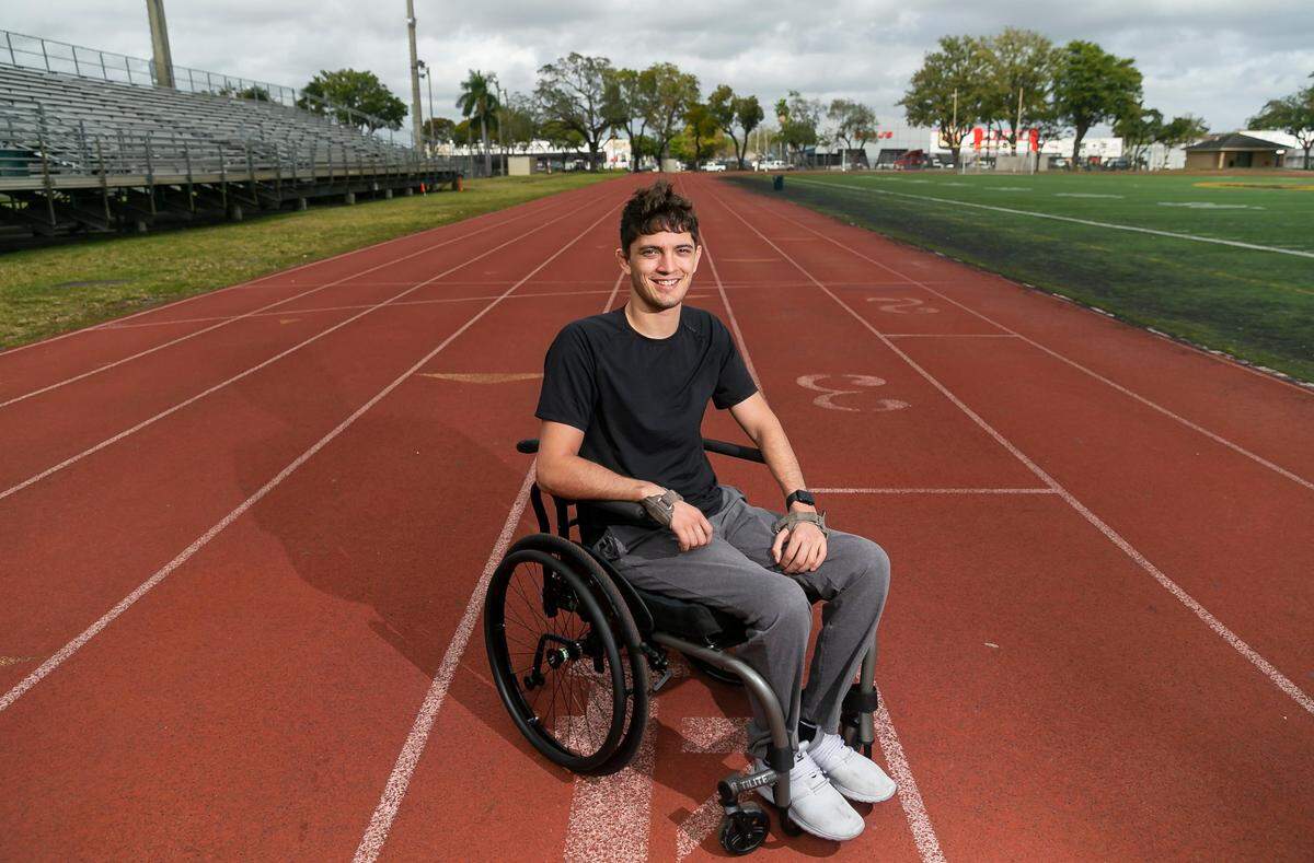 Ben Kunzle, 24, has been training at Miami’s Curtis Park in preparation for Saturday’s Tropical 5K race. Kunzle, paralyzed in a jiu-jitsu sparring accident eight months ago, will compete in the handcycle division. The race is part of the Lifetime Miami Marathon and Half weekend.