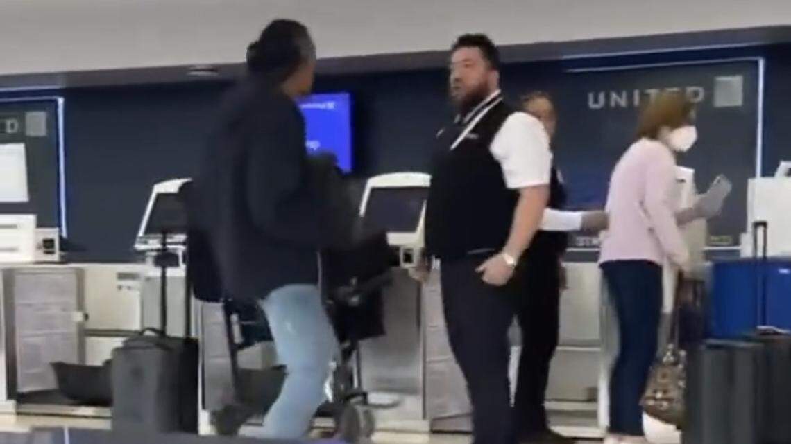 A passenger and a United Airlines worker got in a fight at Newark Liberty International Airport in New Jersey, video shows. The passenger was arrested.