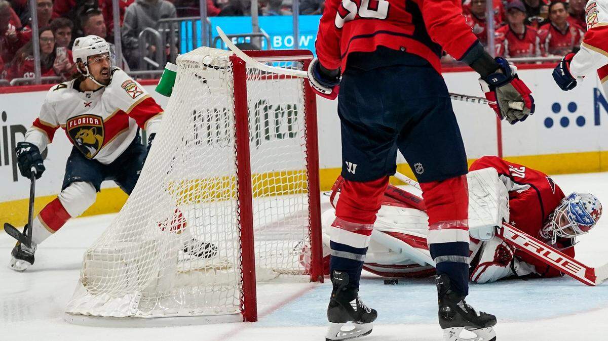 Florida Panthers left wing Ryan Lomberg, left, celebrates his goal past Washington Capitals goaltender Ilya Samsonov (30) during the second period of Game 6 in the first round of the NHL Stanley Cup hockey playoffs, Friday, May 13, 2022, in Washington. (AP Photo/Alex Brandon)