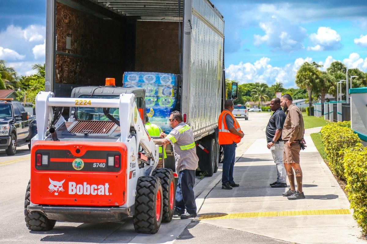 Pallets of water destined to help people in Jackson, Miss., with their ongoing water crisis are loaded into a UPS truck at Betty T. Ferguson Recreational Complex park in Miami Gardens on Monday.