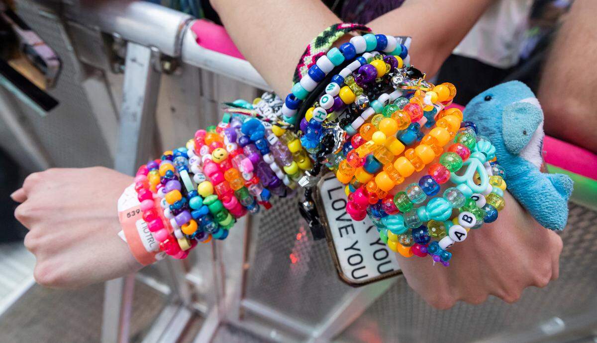 Isabella Martino shows her kandi bracelets during Ultra Music Festival’s 25th anniversary at Bayfront Park on Saturday, March 29, 2025, in downtown Miami, Fla.