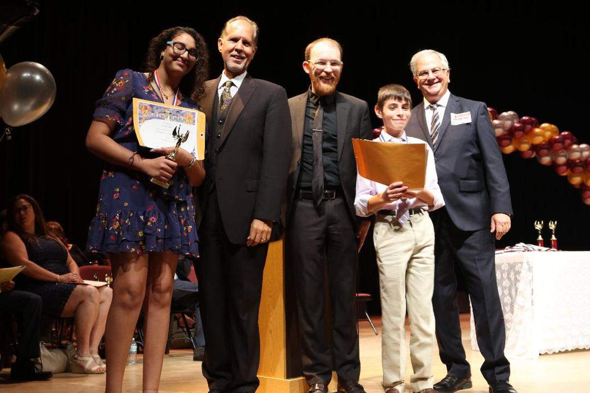 Amani Dahab and Kyle Brenner from Ruth Broad Bay Harbor K-8 Center were recently named winners of the 2019 Bob Novack Music Award. As winners, the students received a trophy, certificate, plaque and a $200 scholarship. From left: Amani Dahab, Onil Rodriguez, Phil Bracken-Tripp, Kyle Brenner and Paul Novack.