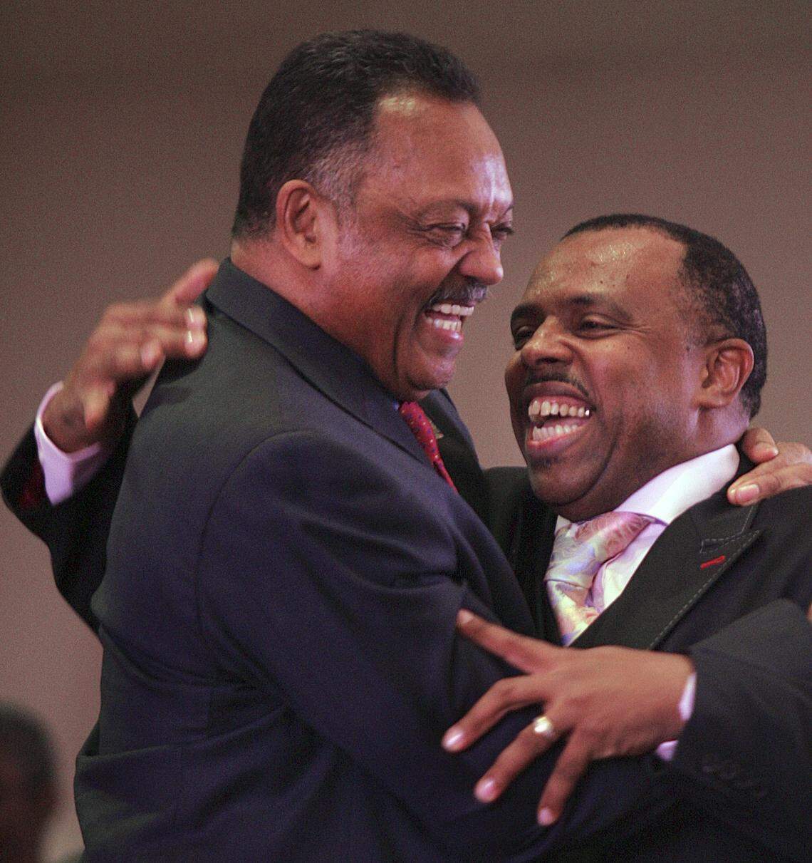 In 2008 in Miami, the Rev. Jesse Jackson and the Rev. Carl Johnson, senior pastor of 93rd Street Community Baptist Church, embrace.