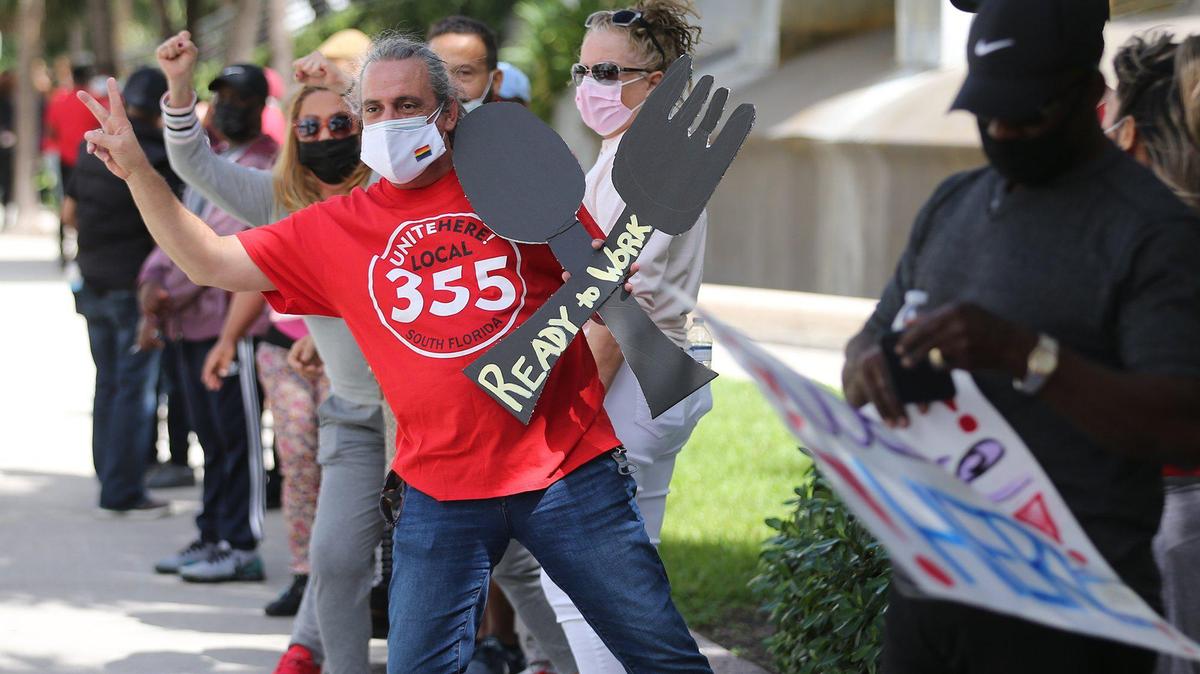 Diplomat Beach Resort workers protest in Hollywood, Florida, Friday, March 12, 2021. Workers protested in front of the hotel to demand their jobs back after being laid off for about a year.