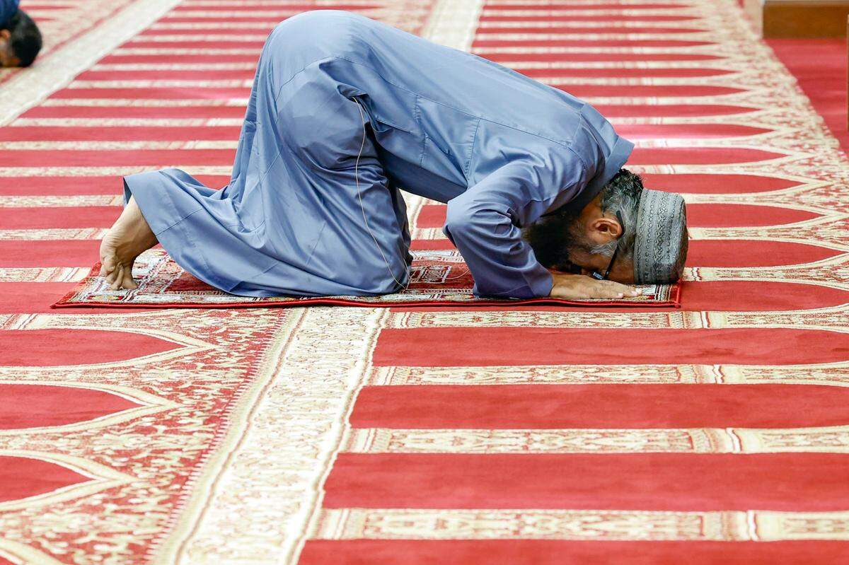 Imam Zakaria Badat prays in honor of the Islamic holiday, the Day of Arafah.