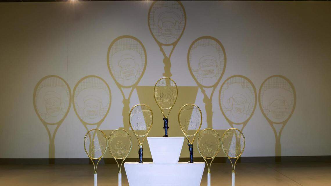 Max Pearce’s “Seize the Moment” is a pyramid of seven golden tennis racquets rewired to highlight athletes who have used victories to highlight crucial social issues.