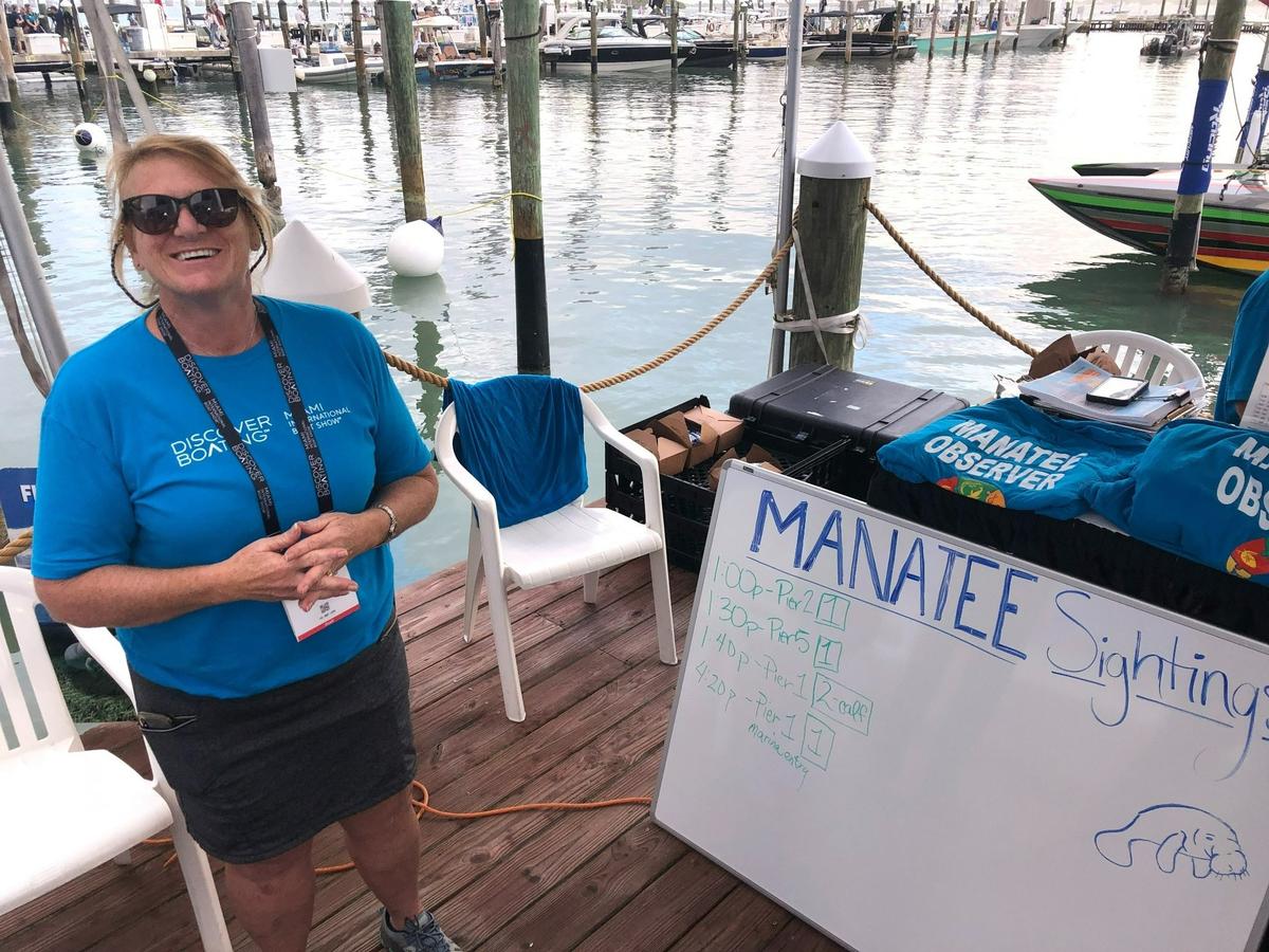 Amy Hirons, a Nova Southeastern University oceanographer and professor who studies manatees and other marine animals, was hired by the Miami International Boat Show to run a manatee-spotting operation for the 2022 event. She’s standing in front of a whiteboard tracking manatee sightings on the show’s first day on Thursday, Feb. 17, 2022.