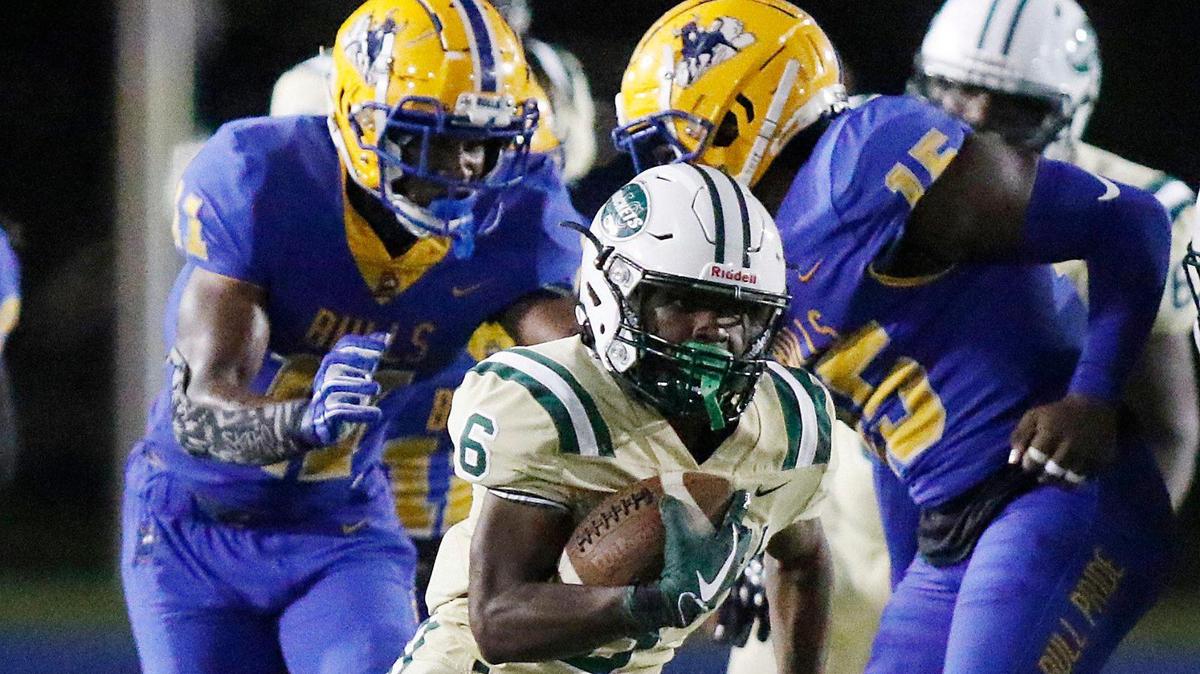 Miami Central Rockets running back Ean Pope (6) carries the ball against Northwestern Bulls during football game Thursday, October 28, 2021 at Traz Powell Stadium in Miami.