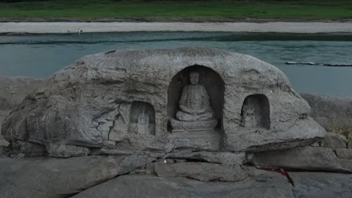 Record-breaking drought and heatwave in China is causing the Yangtze River’s water level to drop, revealing ancient Buddhist statues near Chongqing by Sichuan.