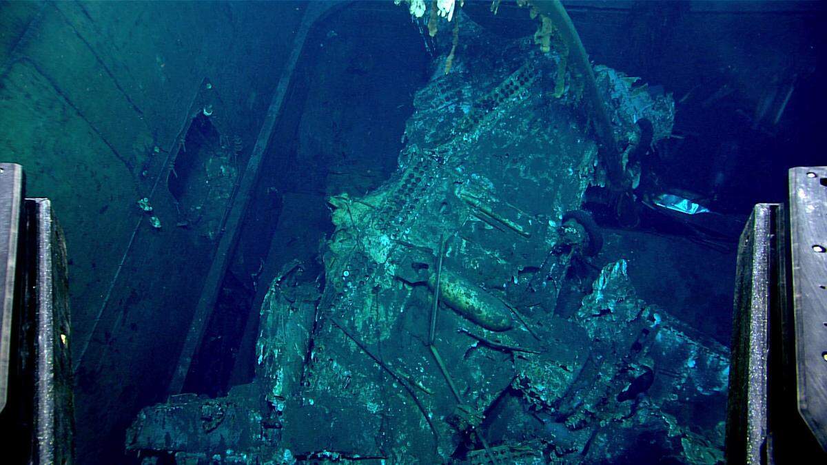 At least three planes were located within the aft Elevator #3 of USS Yorktown during the dive on April 20, including an overturned SBD Dauntless that was still armed with a bomb mounted to the underside of the aircraft’s fuselage.