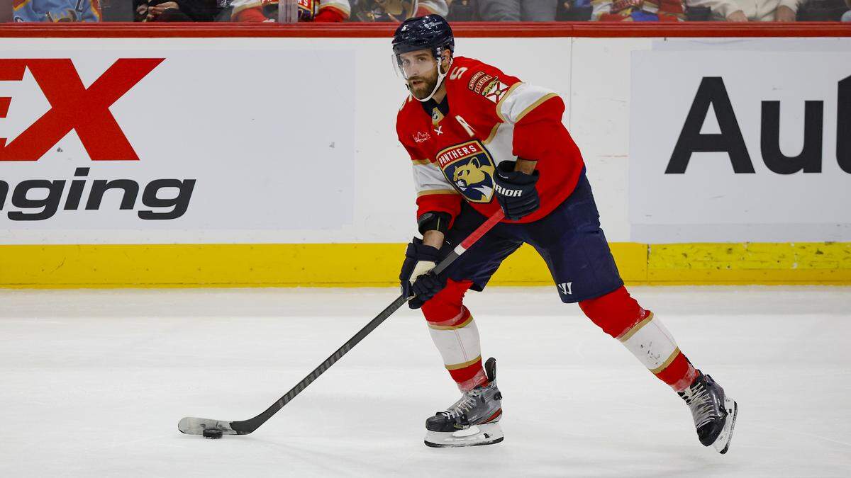 Florida Panthers defenseman Aaron Ekblad (5) controls the puck during the game against the Winnipeg Jets in the third period at Amerant Bank Arena in Sunrise on Friday, November 24, 2023.