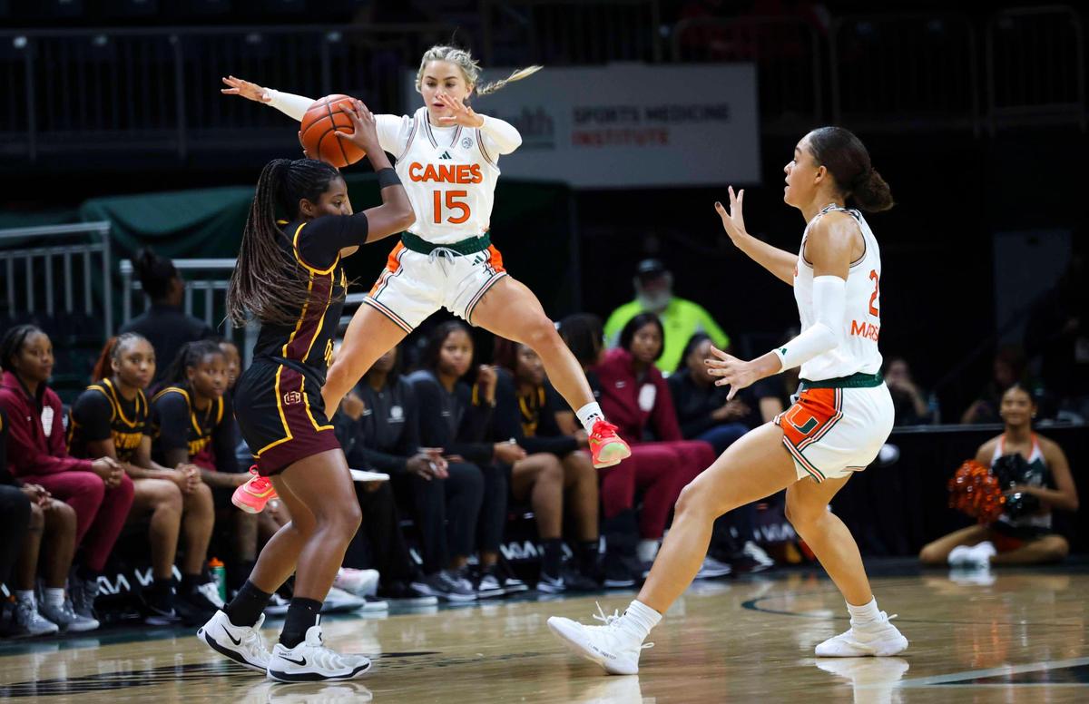Miami Hurricanes Hanna Cavinder(15) jumps while guarding Bethune-Cookman Wildcats Janessa Kelley (5), a Pompano Beach native, during the third quarter of a game on Sunday, Dec. 8, 2024, at Watsco Center in Coral Gables, Fla.