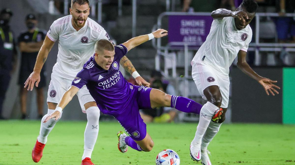 Aug 27, 2021; Orlando, Florida, USA; Inter Miami midfielder Blaise Matuidi (R) and defender Leandro Gonzalez Pirez (L) battle for the ball against Orlando City forward Chris Mueller (9) during the first half at Exploria Stadium.