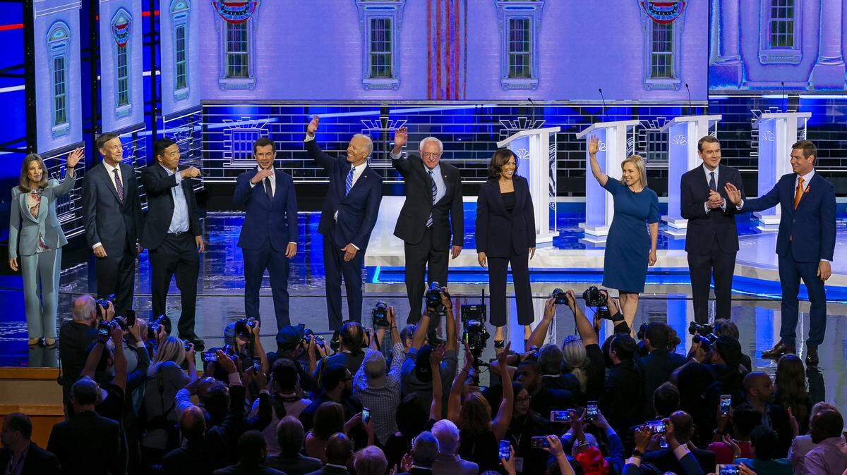 Ten Democratic presidential candidates wave to the crowd before the start of the primary debate for the 2020 elections at the Adrienne Arsht Center for the Performing Arts in Miami on Thursday, June 27, 2019. Ten other candidates debated Wednesday night.