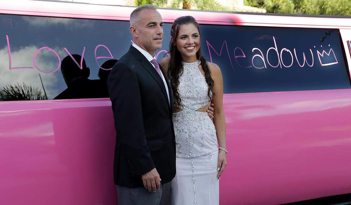 Andrew Pollack father of Meadow Pollack posed with her daughter’s best friend Carley Ogozaly next to a pink (Meadow’s favorite color) limousine with messages to honor her written by friends before heading to the prom, Meadow was one of four seniors killed in shooting at Marjory Stoneman Douglas High School in Parkland, FL, on Saturday, May 05, 2018.