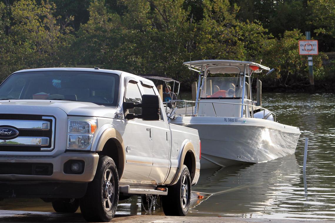Nelson Anzardo backs his Ford pickup truck down a boat ramp at Blackpoint Marina Wednesday, April 29, 2020, to launch his center console vessel.