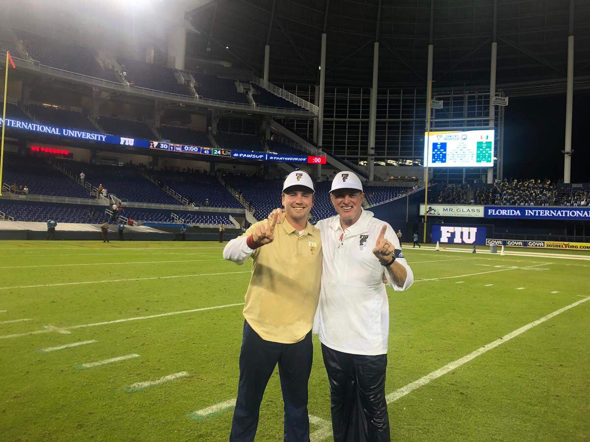 Drew Davis, assistant coach at St. Thomas University, seen here with his father, former University of Miami and FIU football coach Butch Davis.