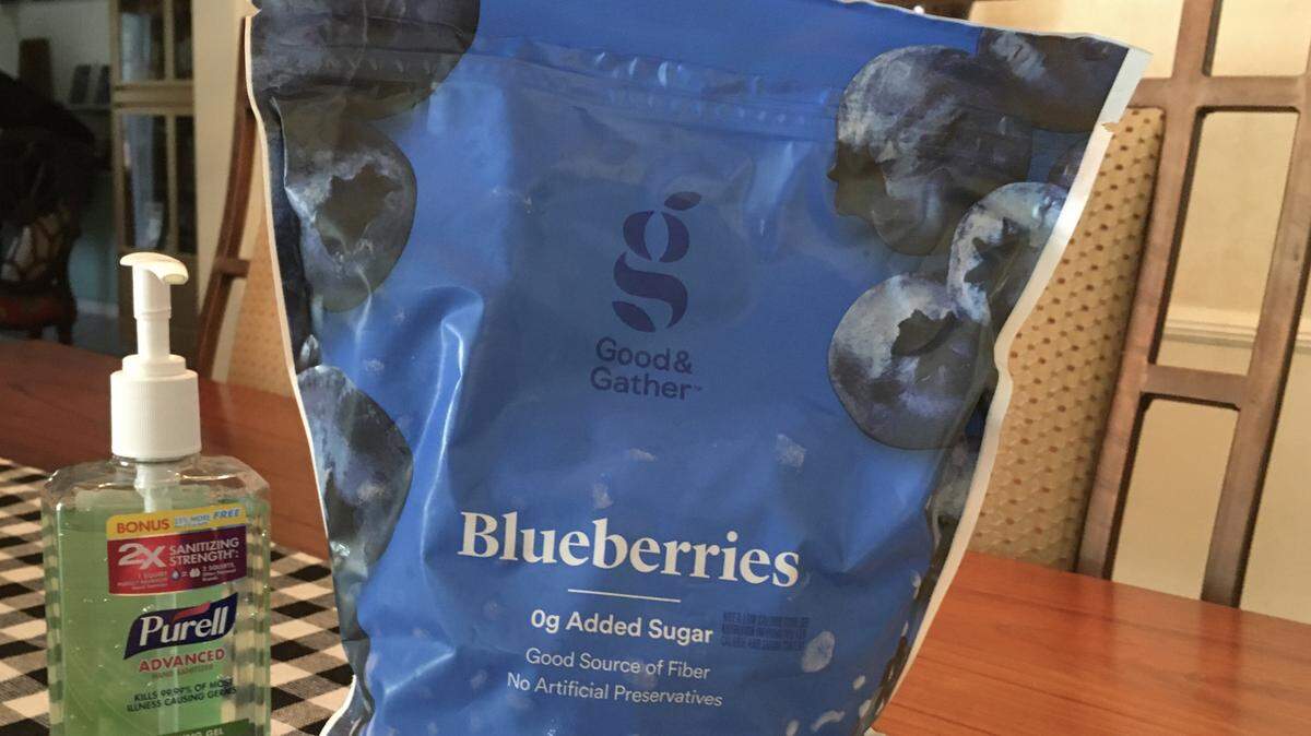 Frozen blueberries were dropped off at my house by a caring neighbor who volunteered to bring me some food supplies.