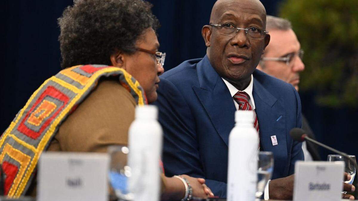 Trinidad and Tobago Prime Minister Keith Rowley (R) speaks with Mia Amor Mottley, Prime Minister of Barbados, during a meeting hosted by the US Vice President with Caribbean Leaders at the 9th Summit of the Americas in Los Angeles, California, June 9, 2022. (Photo by Jim WATSON / AFP) (Photo by JIM WATSON/AFP via Getty Images)