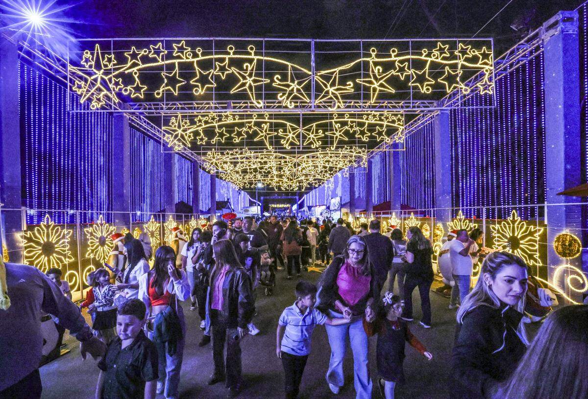 Families arrive for opening night at Christmas Wonderland at Tropical Park, a Miami-style holiday celebration of flavor and culture in Miami, Florida on Thursday, November 13, 2025.